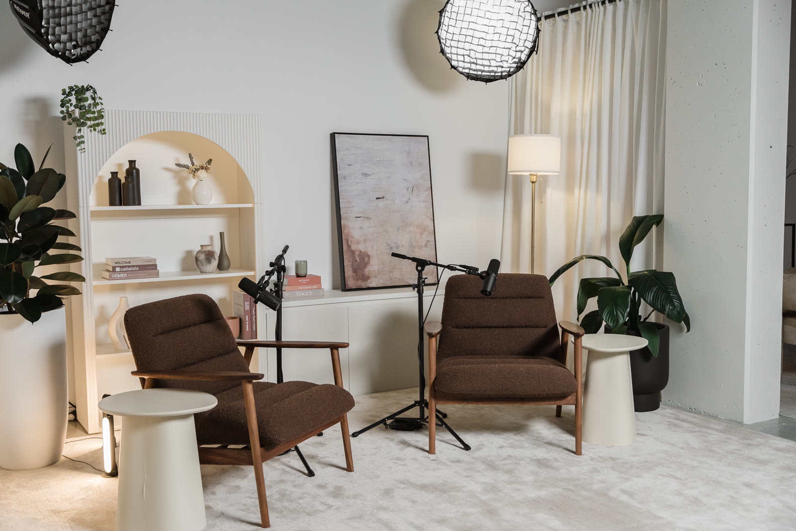 Two-seat conversation set with warm lighting for long-form video